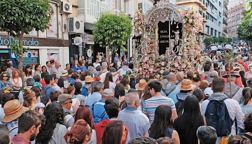 Multitud celebra procesión con un carro adornado con flores. Se pregunta: ¿dónde está el rocío?